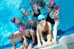 happy children group  at swimming pool photo