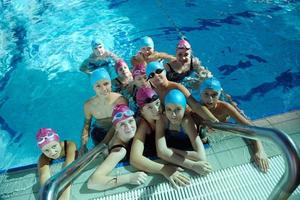 happy childrens at swimming pool photo