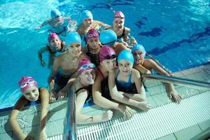 happy childrens at swimming pool photo