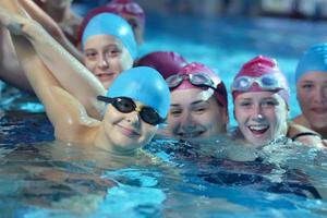 happy children group  at swimming pool photo