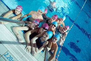 happy children group  at swimming pool photo