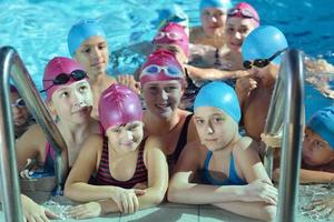 happy children group  at swimming pool photo