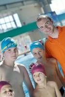 happy children group  at swimming pool photo