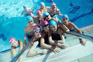 happy children group  at swimming pool photo