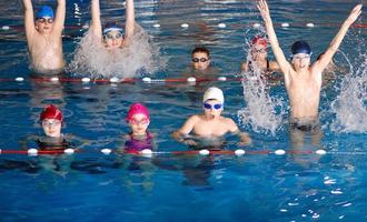 .childrens having fun in a swimming pool photo