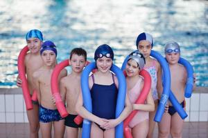 happy children group  at swimming pool photo