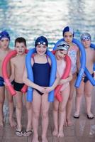 happy children group  at swimming pool photo