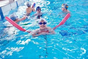 happy children group  at swimming pool photo