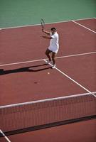 young man play tennis photo