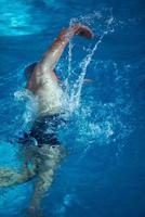 swimmer excercise on indoor swimming poo photo