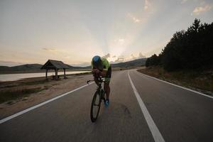 triathlon athlete riding bike photo