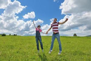 Portrait of romantic young couple smiling together outdoor photo