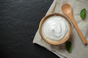 Natural yogurt on stone background photo