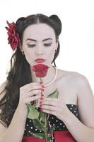 young woman with rose flower isolated on white photo