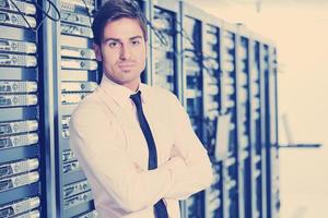 young it engeneer in datacenter server room photo