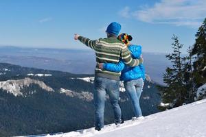 young couple on winter vacation photo