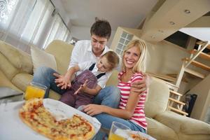 family eating pizza photo