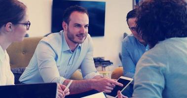 Startup Business Team At A Meeting at modern office building photo