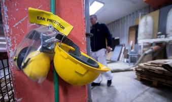 standard security equipment yellow helmet and ears protection photo