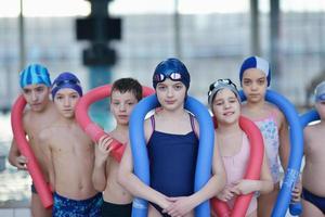 happy children group  at swimming pool photo