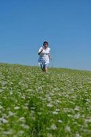 Young happy woman in green field photo