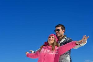 young couple on winter vacation photo