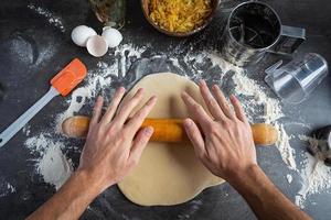 Homemade making dough of pizza, pierogi. Preparation dough for cooking photo