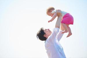 mom and baby on beach  have fun photo