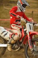 Riding a motocross bike photo