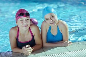 happy children group  at swimming pool photo