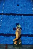 young swimmmer on swimming start photo