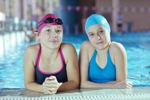 happy children group  at swimming pool photo