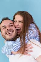 young man piggybacking his girlfriend photo