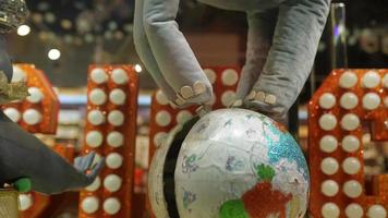 Stuffed elephant toy walks making  globe spin video