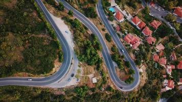 Aerial view of winding road through residential area video