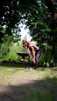 Fitness young woman exercising at the park video