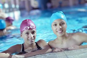 happy children group  at swimming pool photo