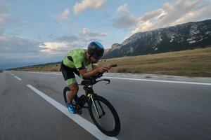 triathlon athlete riding bike photo