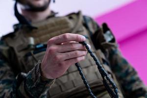 soldier praying tespih photo