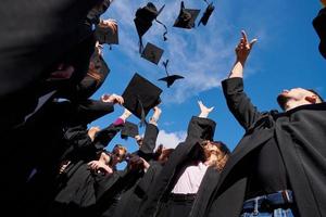 Group of diverse international graduating students celebrating photo