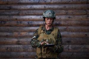 woman soldier using tablet computer photo