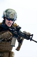 soldier in action aiming laseer sight optics photo