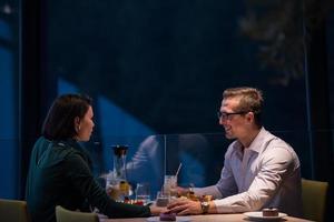 loving couple enjoying romantic dinner photo