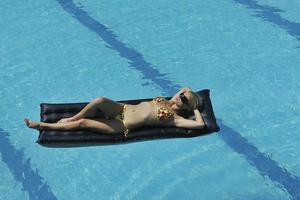 beautiful woman relax on swimming pool photo