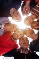 group of happy young people showing their unity photo