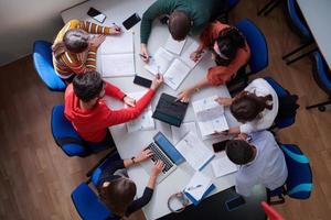 students use modern technology for a school project photo