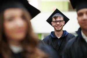 Group of diverse international graduating students celebrating photo