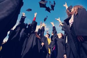 Group of diverse international graduating students celebrating photo