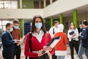 Portrait of multiethnic students group at university wearing protective face mask photo