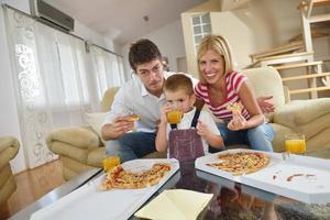 family eating pizza photo